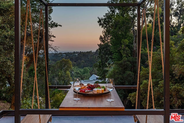 view of balcony at dusk