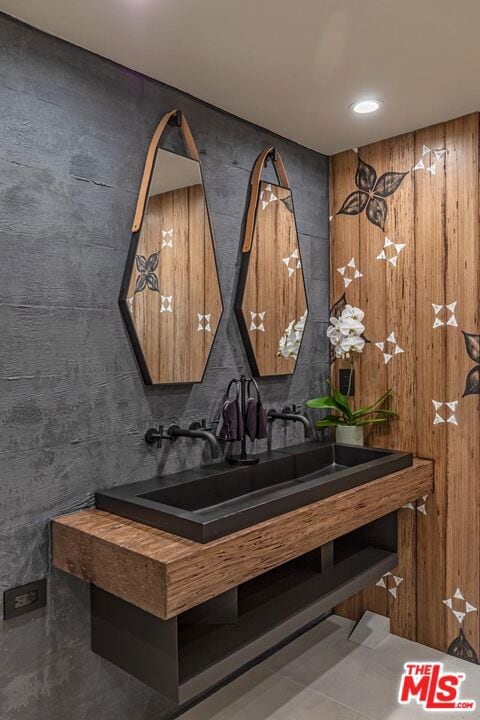 bathroom with vanity and concrete flooring