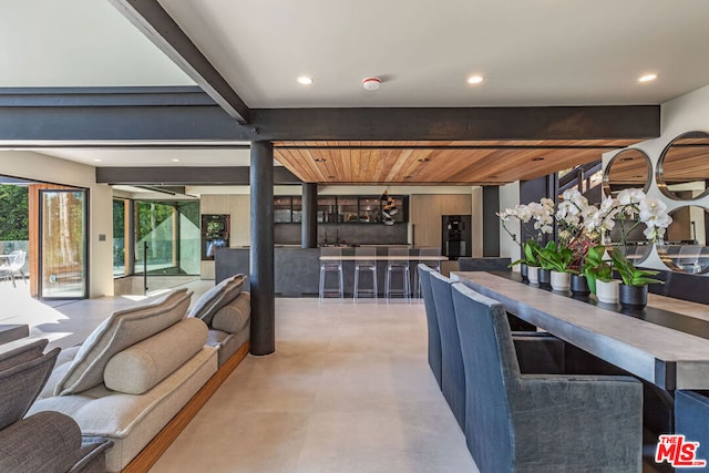 dining room with beam ceiling