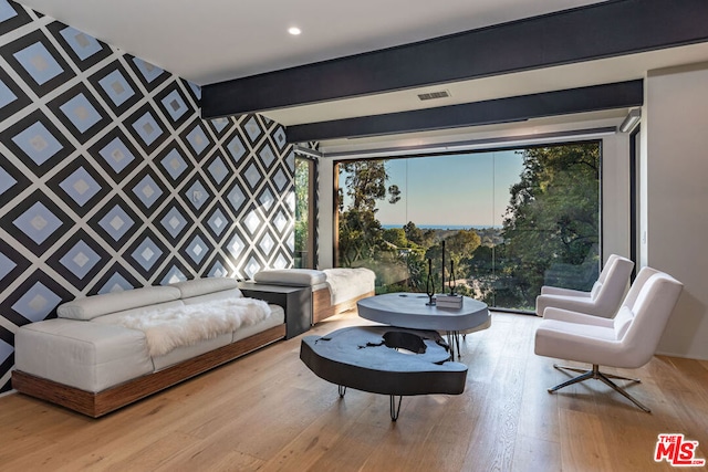 sitting room with light hardwood / wood-style flooring