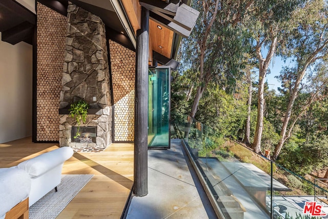 view of patio / terrace with an outdoor stone fireplace