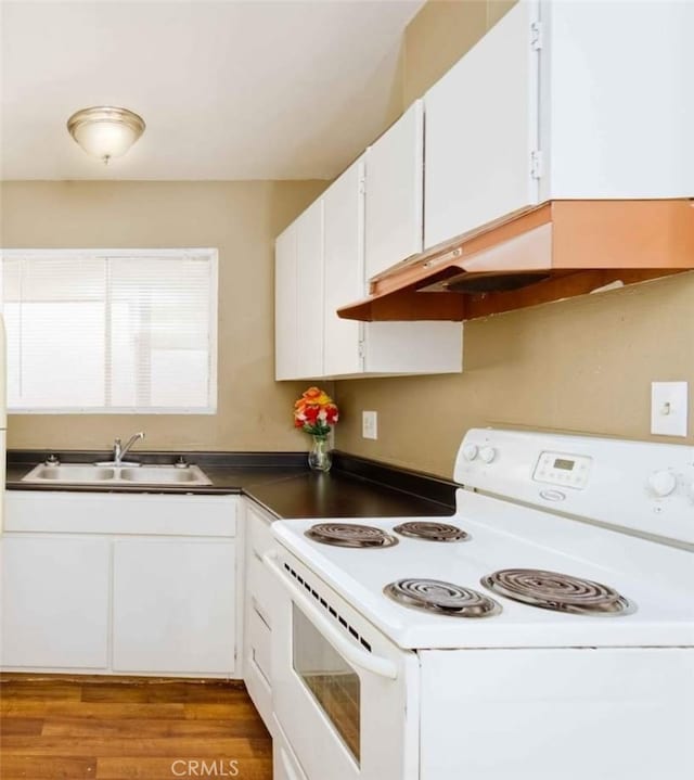 kitchen featuring white cabinets, light wood-type flooring, white electric stove, and sink