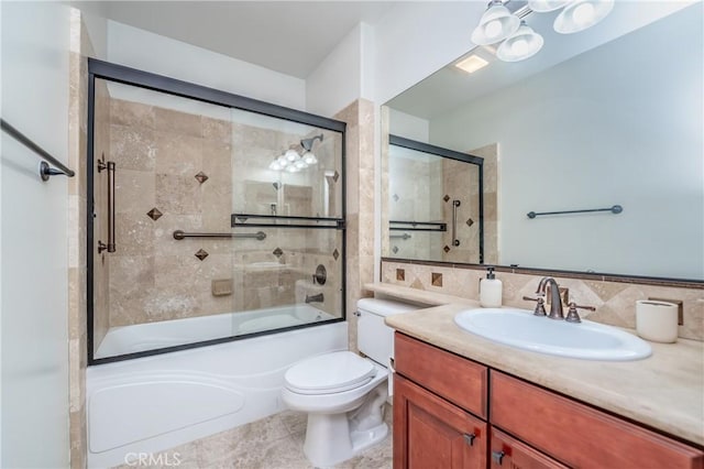 full bathroom featuring tile patterned floors, bath / shower combo with glass door, toilet, decorative backsplash, and vanity