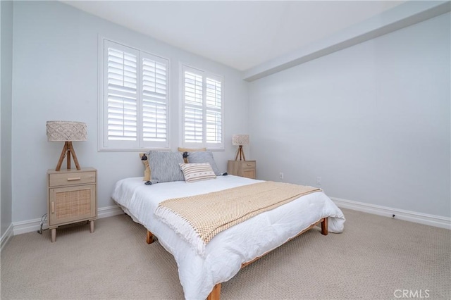 bedroom featuring light colored carpet