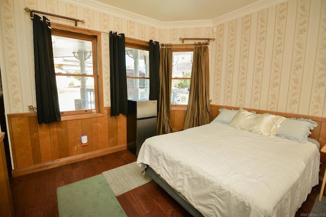 bedroom featuring wooden walls, ornamental molding, and dark hardwood / wood-style flooring