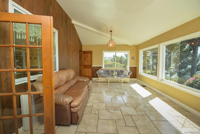 unfurnished sunroom with vaulted ceiling