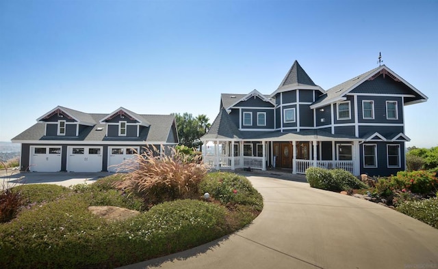 view of front of property featuring a garage and covered porch