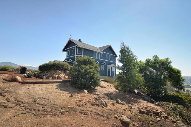 view of home's exterior featuring a mountain view