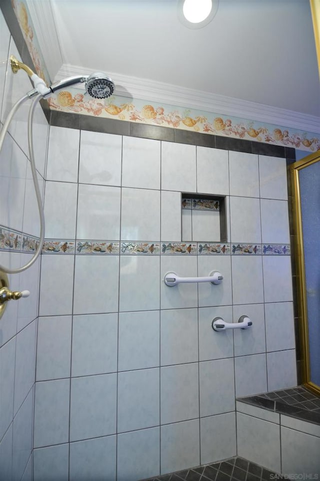 bathroom with a tile shower