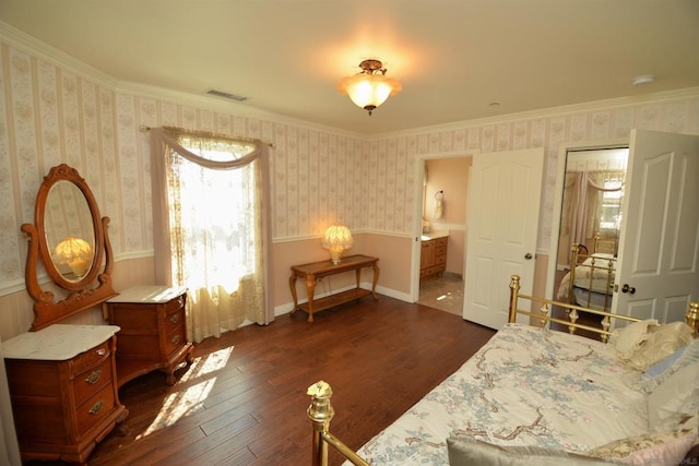 sitting room featuring dark hardwood / wood-style floors and ornamental molding