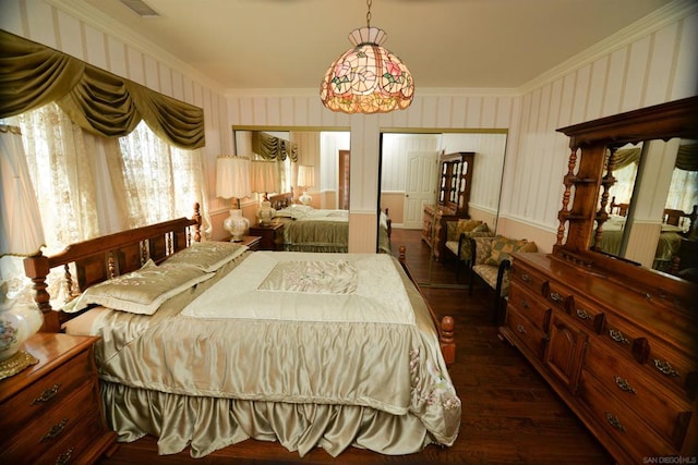 bedroom with dark hardwood / wood-style flooring and crown molding