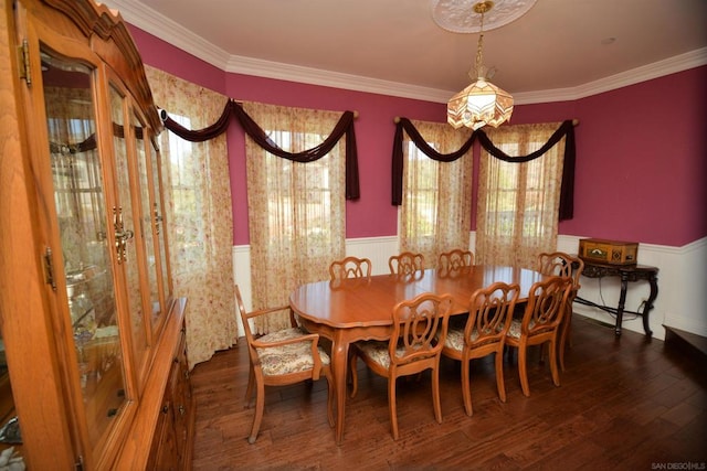 dining room featuring dark hardwood / wood-style floors and crown molding