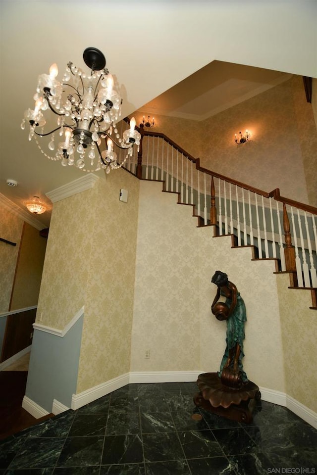 staircase featuring a chandelier and ornamental molding