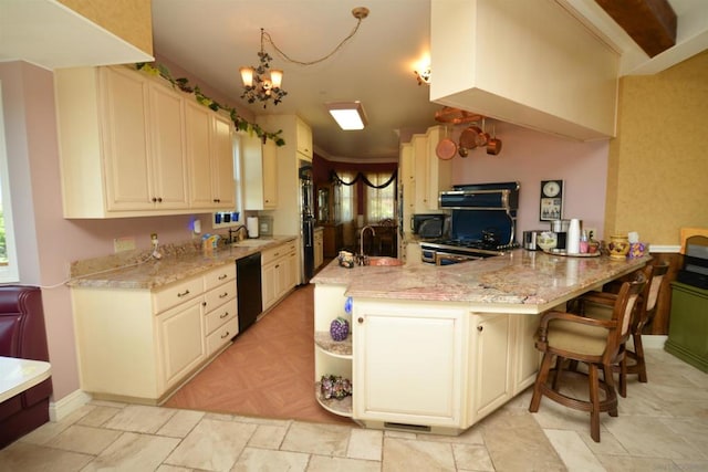 kitchen with hanging light fixtures, kitchen peninsula, a breakfast bar area, extractor fan, and black dishwasher