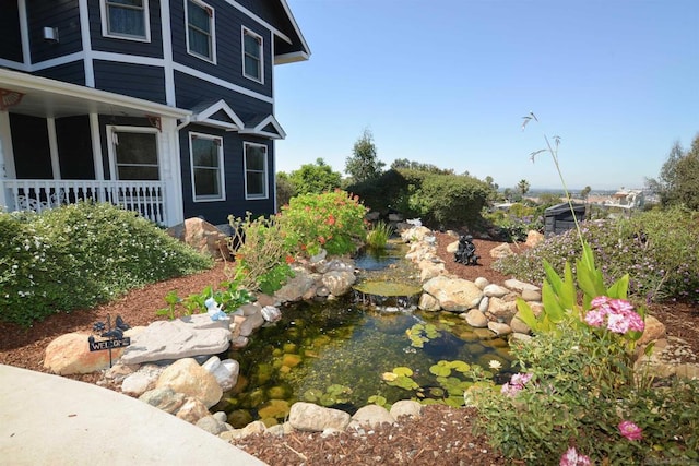 view of yard with a small pond