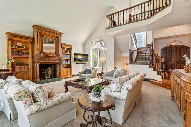 carpeted living room featuring high vaulted ceiling