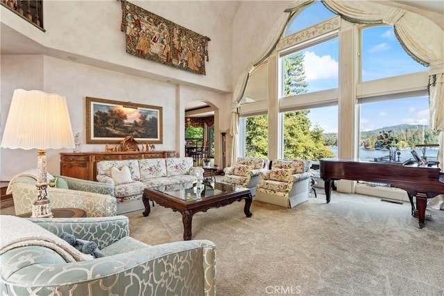 sunroom / solarium featuring a water view