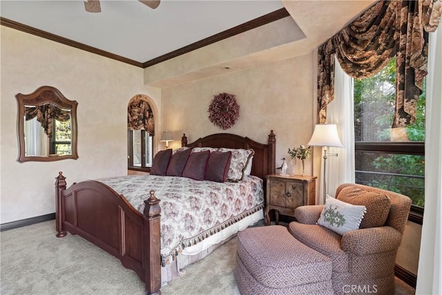 bedroom featuring ceiling fan, light colored carpet, and ornamental molding