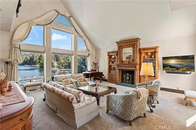 carpeted living room featuring a water view and high vaulted ceiling