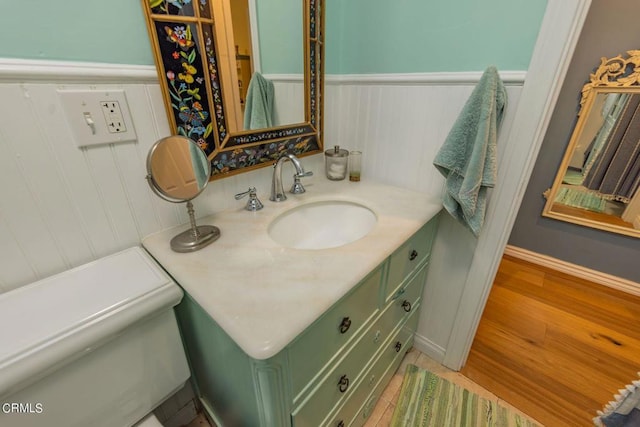 bathroom with hardwood / wood-style flooring and vanity