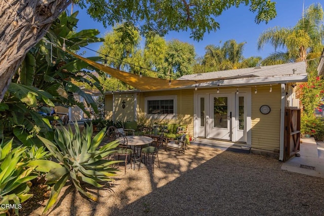 back of house with a patio area