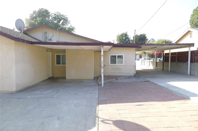 rear view of house with a carport