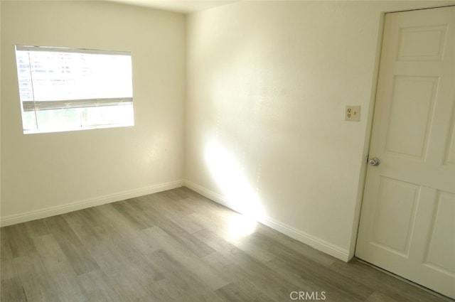 spare room featuring light hardwood / wood-style flooring