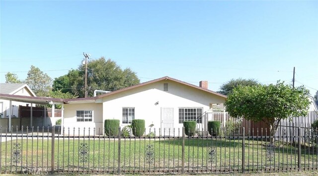 ranch-style house with a front lawn and a carport