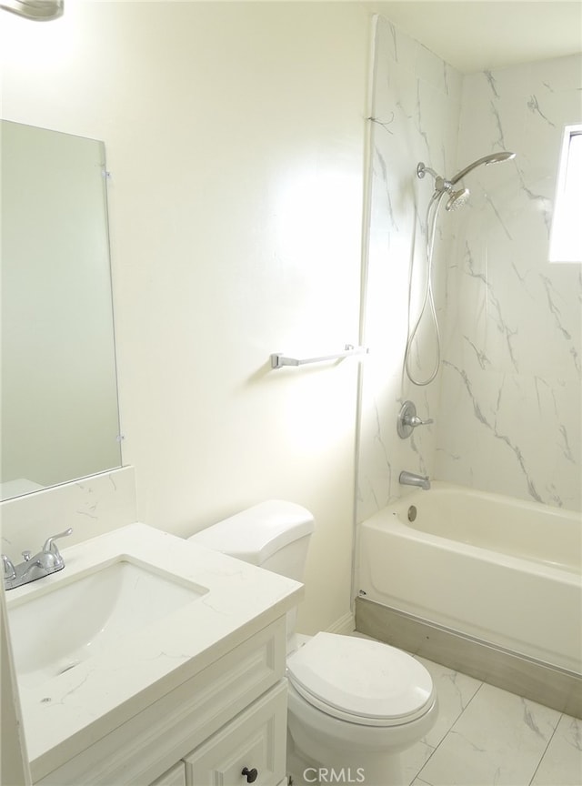 full bathroom with vanity, tiled shower / bath, and toilet