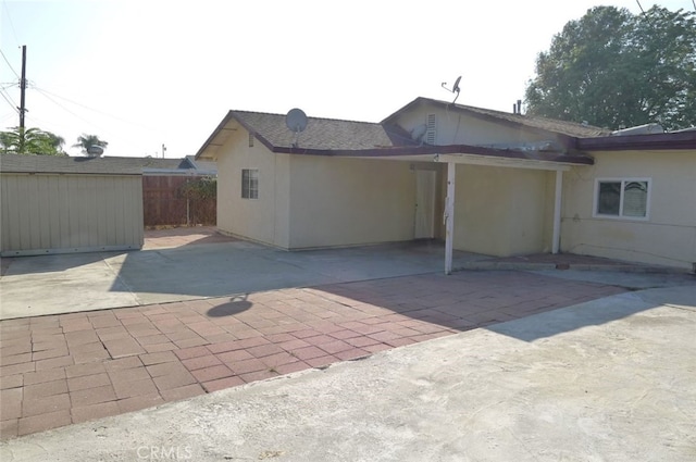 view of side of home featuring a patio area