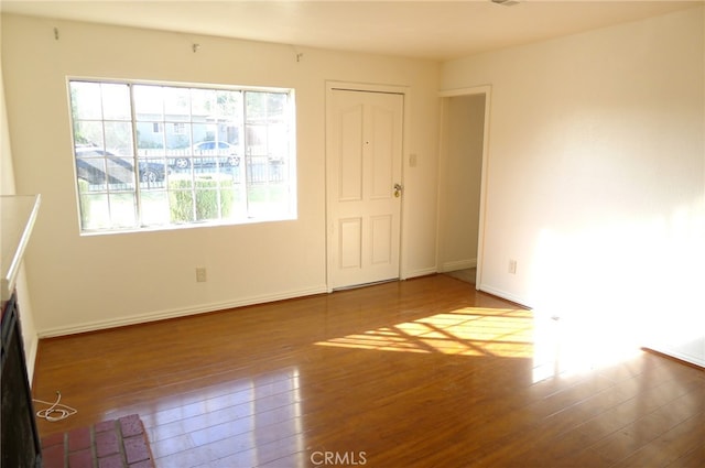 unfurnished bedroom featuring a closet and hardwood / wood-style floors