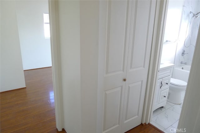 hallway featuring hardwood / wood-style flooring