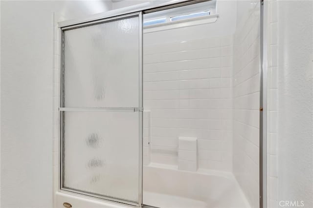 1169 Aztec, Topanga, CA 90290 - bathroom featuring combined bath / shower with glass door and a textured wall