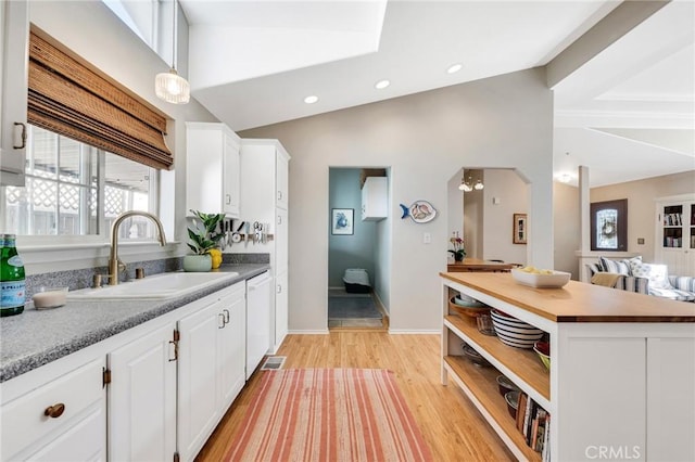 1169 Aztec, Topanga, CA 90290 - kitchen featuring a sink, white dishwasher, open shelves, white cabinets, and light wood finished floors