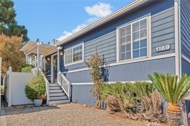 view of property exterior with fence