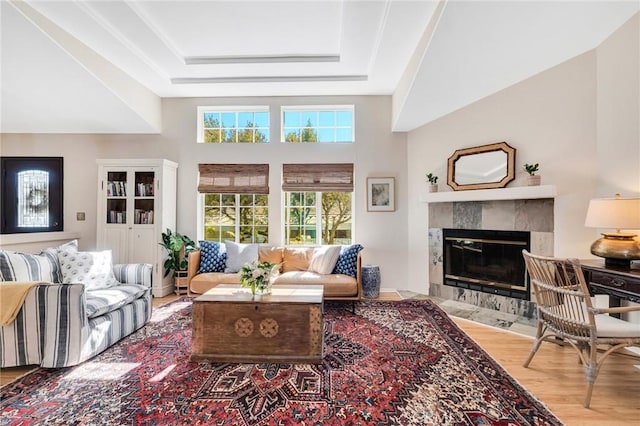 1169 Aztec, Topanga, CA 90290 - living area featuring wood finished floors, a tray ceiling, and a tile fireplace