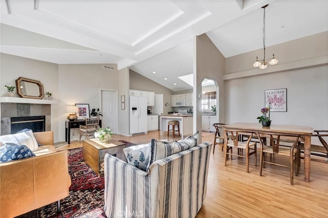 1169 Aztec, Topanga, CA 90290 - living area featuring light wood finished floors, a fireplace, and high vaulted ceiling
