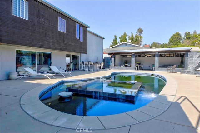 view of pool featuring a patio area