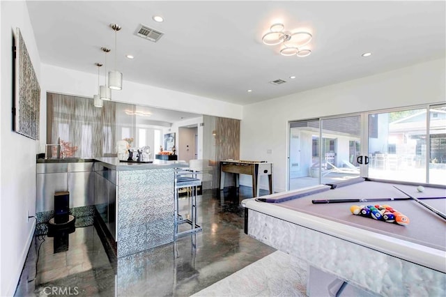 kitchen featuring pendant lighting and pool table