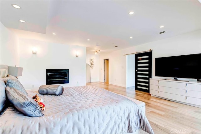 bedroom with light hardwood / wood-style flooring