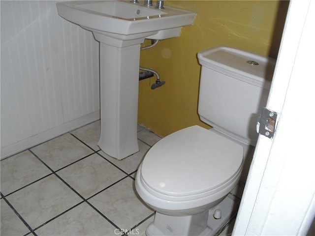 bathroom with tile patterned flooring and toilet