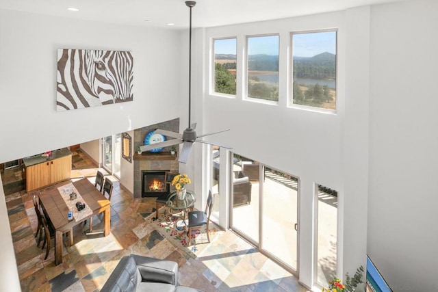 living room featuring a tile fireplace