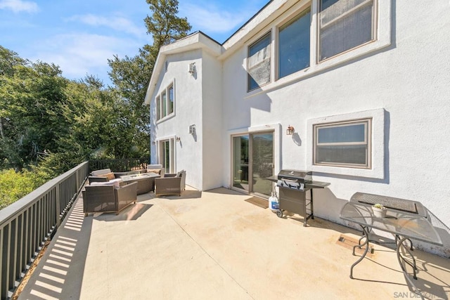 exterior space featuring a patio and an outdoor living space