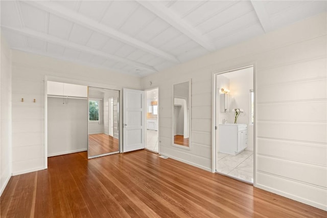 661 W 26th St, San Pedro, CA 90731 - unfurnished bedroom with a closet, light wood-style flooring, beam ceiling, baseboards, and ensuite bathroom