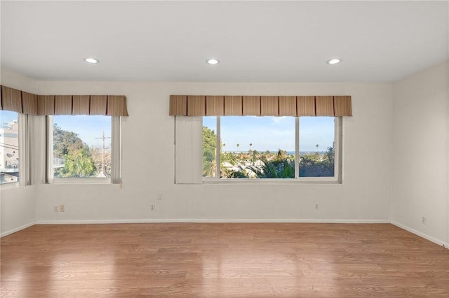 661 W 26th St, San Pedro, CA 90731 - empty room with healthy amount of natural light, light wood-style floors, recessed lighting, and baseboards