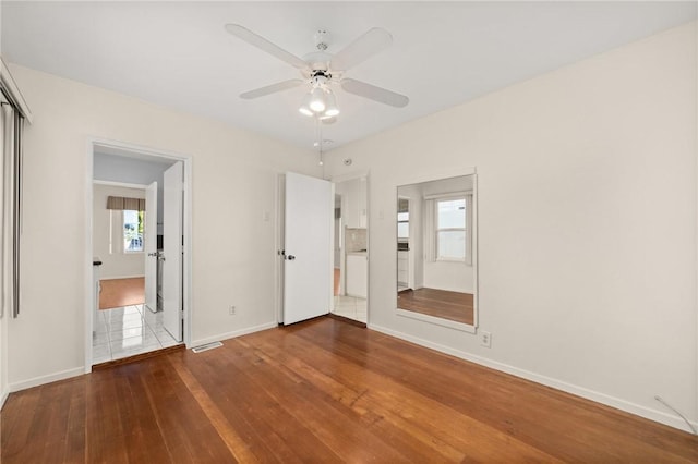 661 W 26th St, San Pedro, CA 90731 - unfurnished bedroom with hardwood / wood-style flooring, baseboards, and multiple windows