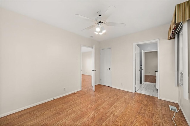 661 W 26th St, San Pedro, CA 90731 - unfurnished bedroom with light wood-style flooring, baseboards, and a ceiling fan