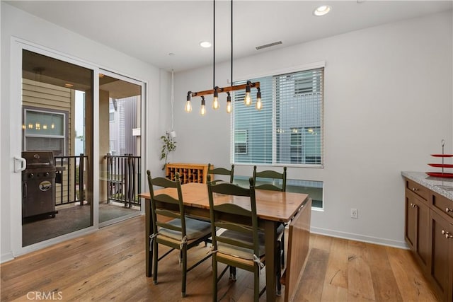 dining area with light wood-type flooring