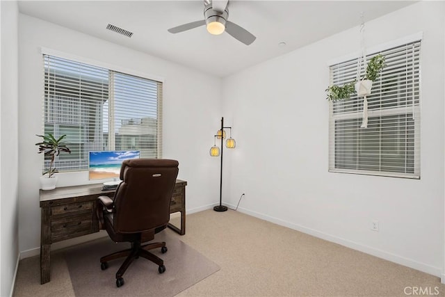 office featuring light carpet and ceiling fan