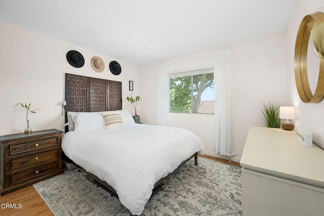 bedroom with light hardwood / wood-style floors